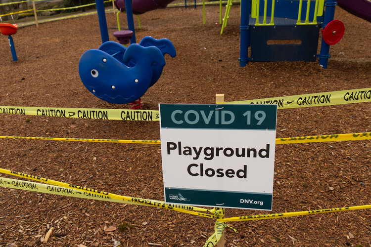 Deep Cove, Canada - April 1, 2020: View of sign Playground Closed due to COVID-19(Coronavirus) in Panorama Park