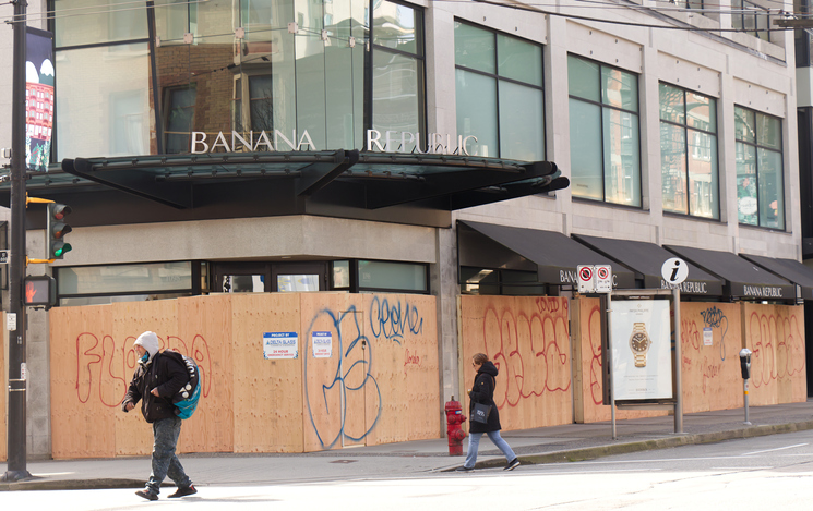 Vancouver, Canada - April 2, 2020: Vancouver shops have boarded up their storefronts with wood following an increase in break-and-enters due to business shutdown caused by COVID-19
